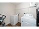 The laundry room features a washer, a dryer, and wire shelving at 73 Windswept Way, Fuquay Varina, NC 27526