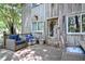 Inviting porch with outdoor seating, charming front door and decor at 82 Deercorn Path, Moncure, NC 27559