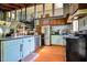 A well-lit kitchen with stainless steel appliances and blue cabinets, offering a blend of modern and classic style at 82 Deercorn Path, Moncure, NC 27559