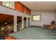 Cozy living room featuring abundant natural light and a unique loft design at 82 Deercorn Path, Moncure, NC 27559