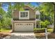 Charming two-story home with a two-car garage and neatly landscaped front yard at 8200 Shadow Stone Ct, Raleigh, NC 27613