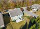 Aerial view of the home and backyard featuring a patio with furniture, fenced yard, and mature trees at 901 Lemongrass Ln, Wake Forest, NC 27587