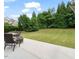 Spacious backyard showcasing a patio and lush landscaping at 901 Lemongrass Ln, Wake Forest, NC 27587