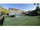 Spacious backyard with a patio, furniture, and a fence surrounding the lawn, perfect for outdoor activities at 901 Lemongrass Ln, Wake Forest, NC 27587