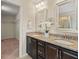 Bathroom vanity featuring dual sinks, granite countertop, and dark cabinetry at 901 Lemongrass Ln, Wake Forest, NC 27587