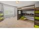 Modern bedroom with built-in bunk, large window, and carpeted floor at 901 Lemongrass Ln, Wake Forest, NC 27587