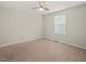 Carpeted bedroom featuring a ceiling fan and a window for natural light at 901 Lemongrass Ln, Wake Forest, NC 27587