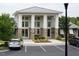 Beautiful clubhouse featuring stone accents, large windows, and ample parking at 901 Lemongrass Ln, Wake Forest, NC 27587