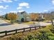Charming two-story home with landscaped yard, covered porch, and a two-car garage on a sunny day at 901 Lemongrass Ln, Wake Forest, NC 27587