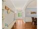 Warm and inviting foyer with hardwood floors, decorative wall hooks, and a charming bench at 901 Lemongrass Ln, Wake Forest, NC 27587