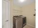 Laundry room featuring modern appliances and a wire rack for storage at 901 Lemongrass Ln, Wake Forest, NC 27587