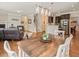 Open-concept living room with hardwood floors, fireplace, and updated kitchen at 901 Lemongrass Ln, Wake Forest, NC 27587