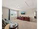 Comfortable living room with large window, plush carpet, and built-in storage cabinets at 901 Lemongrass Ln, Wake Forest, NC 27587