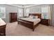 Spacious bedroom with tray ceiling, carpet, and lots of natural light at 901 Lemongrass Ln, Wake Forest, NC 27587