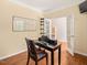 Functional office space featuring hardwood floors, neutral walls, and glass French doors at 901 Lemongrass Ln, Wake Forest, NC 27587