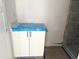 Bright bathroom with white vanity and new shower with decorative gray tiles at 901 Linwood Ave, Durham, NC 27701