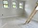 Bedroom featuring three new windows for natural light and modern trim at 901 Linwood Ave, Durham, NC 27701