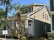 Side view of a craftsman home featuring two tone siding and a covered front porch at 901 Linwood Ave, Durham, NC 27701