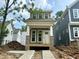 Charming home exterior with decorative dormers, white trim, and stone accents at 901 Linwood Ave, Durham, NC 27701