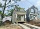 Exterior view of a new construction home with gray siding and a welcoming covered front porch at 901 Linwood Ave, Durham, NC 27701