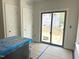 Bright living room with a sliding glass door leading to a new wooden deck at 901 Linwood Ave, Durham, NC 27701