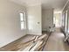 A room that is freshly painted with crown moulding and hardwood floors at 901 Linwood Ave, Durham, NC 27701