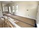 A room freshly painted with multiple windows looking to the outside at 901 Linwood Ave, Durham, NC 27701