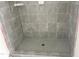 Modern shower with decorative gray tiles and a new shower head installed at 901 Linwood Ave, Durham, NC 27701