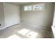 Bright bedroom features double closet doors and natural light from energy-efficient windows at 903 Linwood Ave, Durham, NC 27701