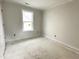 Bright bedroom with large, energy efficient window at 903 Linwood Ave, Durham, NC 27701