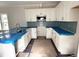 Elegant unfinished kitchen with white cabinetry and a stylish blue tiled backsplash at 903 Linwood Ave, Durham, NC 27701