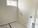 Bright laundry room featuring large window and utility hookups at 903 Linwood Ave, Durham, NC 27701