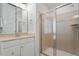 Modern bathroom with a glass-enclosed shower, vanity with ample storage, and contemporary finishes at 9117 Meadow Mist Ct, Raleigh, NC 27617