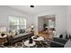 Comfortable living room featuring hardwood floors, a neutral color palette, and natural light at 9117 Meadow Mist Ct, Raleigh, NC 27617