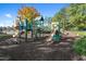 Colorful community playground with multiple slides and climbing structures at 9117 Meadow Mist Ct, Raleigh, NC 27617