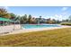 Community pool featuring lounge chairs and a clubhouse in the background at 9117 Meadow Mist Ct, Raleigh, NC 27617