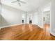 Bright bedroom with hardwood floors and neutral walls, featuring a ceiling fan and white trim at 915 Edgewater Cir, Chapel Hill, NC 27516