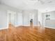 Large, light-filled bonus room with hardwood floors and multiple doorways at 915 Edgewater Cir, Chapel Hill, NC 27516