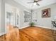 Bright breakfast nook with hardwood floors, large windows, and a modern ceiling fan at 915 Edgewater Cir, Chapel Hill, NC 27516