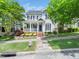 Charming two-story home featuring a welcoming front porch and beautifully landscaped front yard at 915 Edgewater Cir, Chapel Hill, NC 27516
