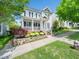 Charming two-story home featuring a welcoming front porch and beautifully landscaped front yard at 915 Edgewater Cir, Chapel Hill, NC 27516