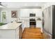 Bright kitchen with stainless steel appliances, quartz countertops, and white subway tile backsplash at 915 Edgewater Cir, Chapel Hill, NC 27516