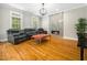 Modern living room boasts a cozy fireplace and gleaming hardwood floors at 915 Edgewater Cir, Chapel Hill, NC 27516