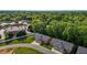 Birds eye view of homes near businesses and green spaces at 928 Arrowhead Ln, Mebane, NC 27302