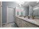 Bathroom featuring double sinks, granite countertops, and white cabinets at 928 Arrowhead Ln, Mebane, NC 27302