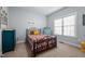 Comfortable bedroom with colorful accents, including a patterned bedspread and bright furnishings at 928 Arrowhead Ln, Mebane, NC 27302