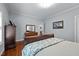 Inviting bedroom with hardwood floors, a comfortable bed, and ample natural light at 928 Arrowhead Ln, Mebane, NC 27302