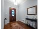Welcoming entryway with hardwood floors, decorative mirror and stylish console table at 928 Arrowhead Ln, Mebane, NC 27302