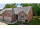 A well maintained brick home with a landscaped yard and covered entryway at 928 Arrowhead Ln, Mebane, NC 27302