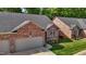 A well maintained brick home with a landscaped yard and covered entryway at 928 Arrowhead Ln, Mebane, NC 27302